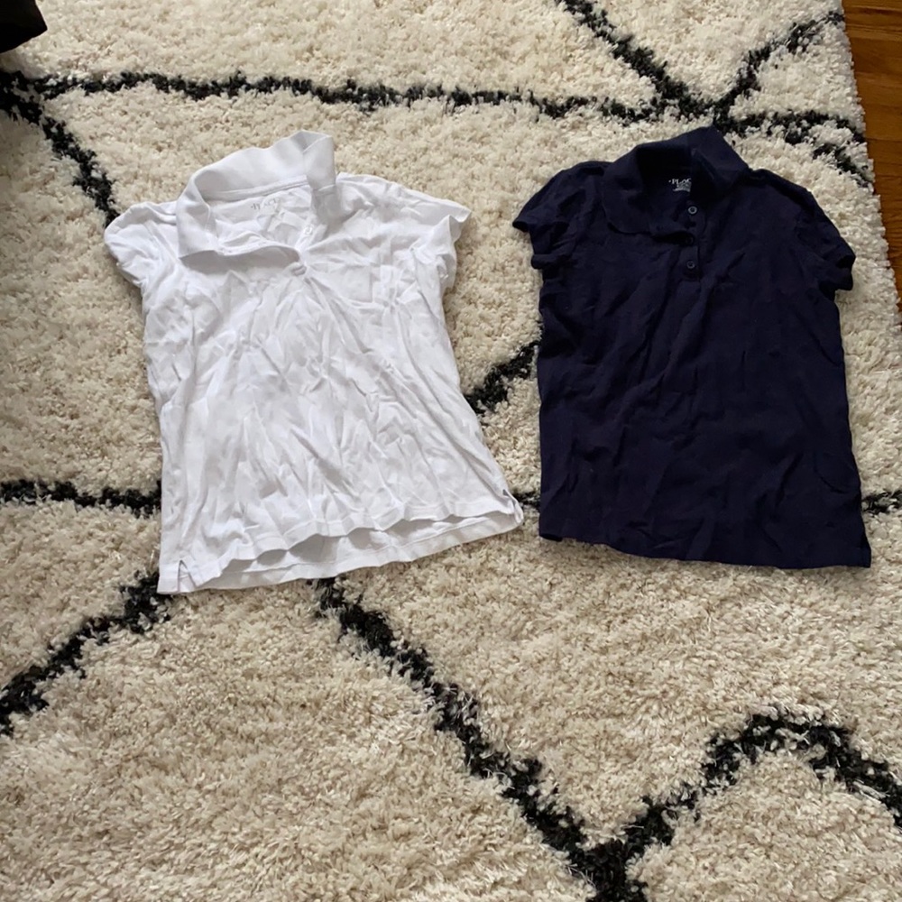 2 Girls size large polos.